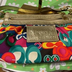 Coach Poppy wristlet in excellent used condition.